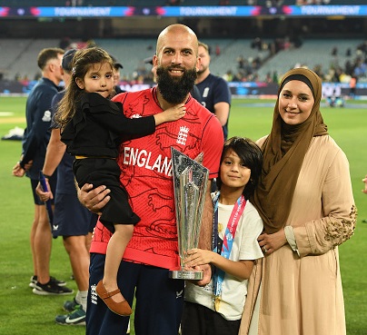 Moeen Ali poses with the T20 World Cup trophy with his family | Getty Images