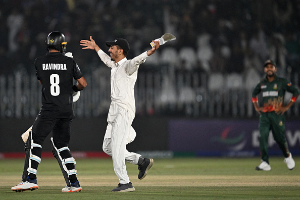A pitch invader runs towards Rachin Ravindra during a Champions Trophy match in Rawalpindi | Getty
