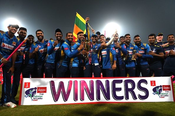 Sri Lankan players pose with the trophy after whitewashing Pakistan in the T20I series | Getty