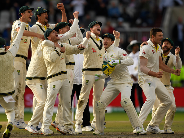 Australian players celebrate after retaining the Ashes at Old Trafford | Getty