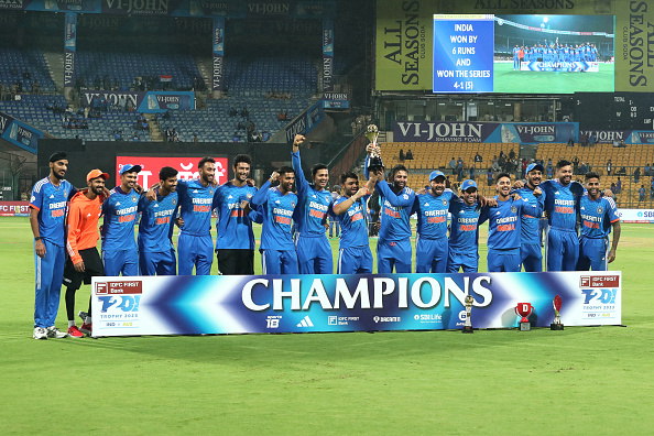 Indian players posing with the T20I trophy | Getty