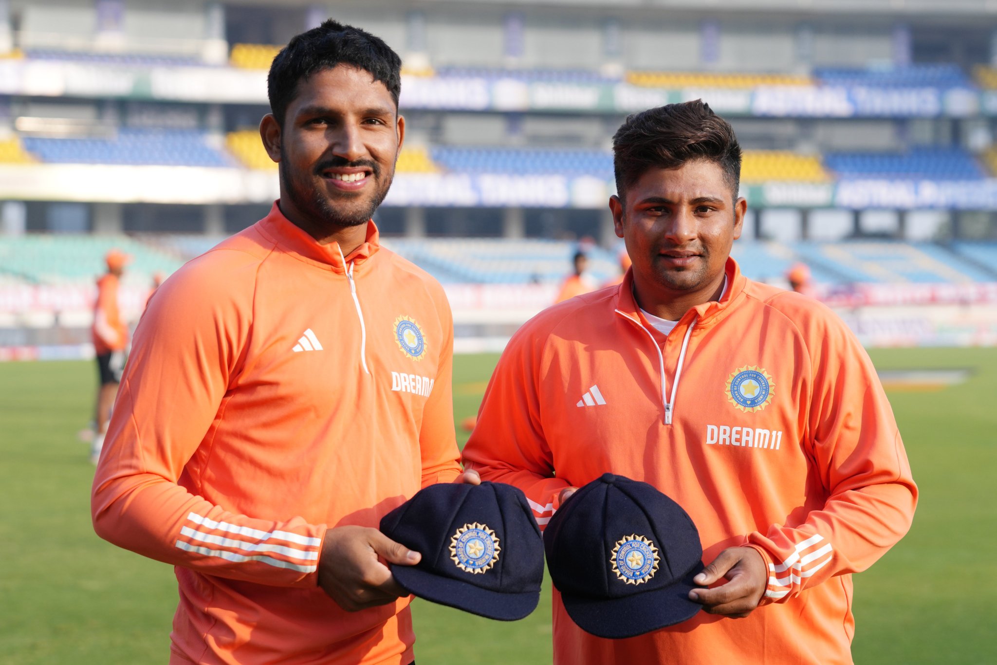 Sarfaraz Khan and Dhruv Jurel posing with their Test caps | BCCI