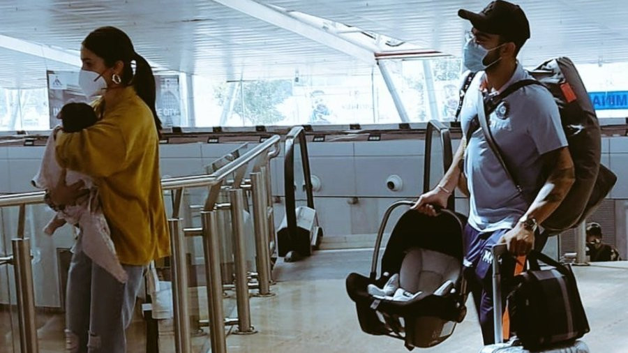 Virat Kohli and Anushka Sharma spotted with daughter Vamika at Pune airport