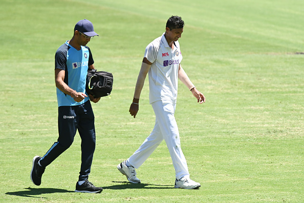 Navdeep Saini walks off with the groin injury | Getty