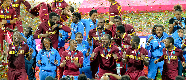 T20 World Champs West Indies Men's and Women's team celebrate on podium | Getty