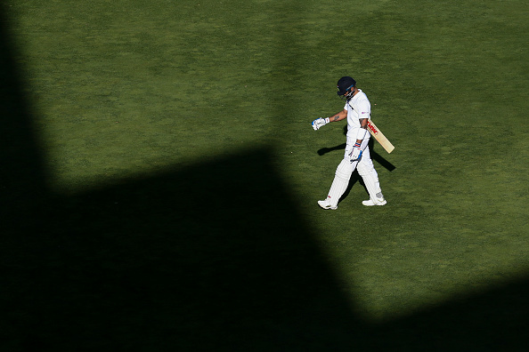 Virat Kohli walks off on day 3 of first Test after getting out to Trent Boult for 16 | Getty
