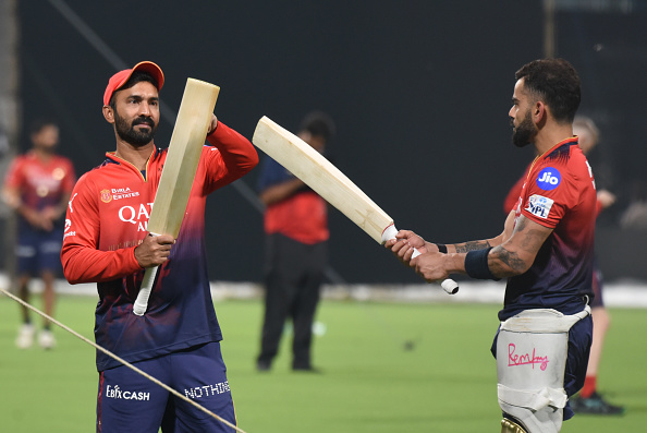 Dinesh Karthik and Virat Kohli | Getty