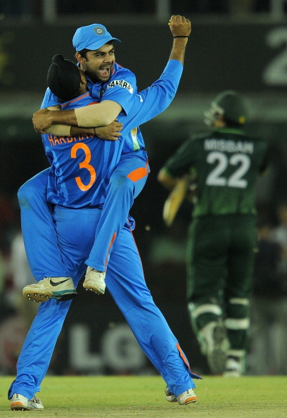 Virat Kohli with Harbhajan Singh during 2011 WC SF vs Pakistan | GETTY