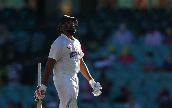 A dejected Rohit Sharma walks off | Getty