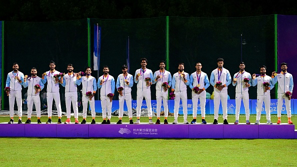 Indian men's cricket team players posing with their gold medals | Getty