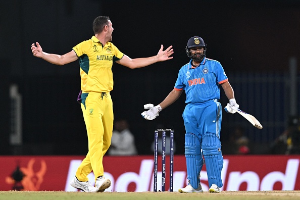 Josh Hazlewood and Rohit Sharma | Getty Images