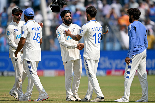 Indian players shaking hands with victorious New Zealanders | Getty