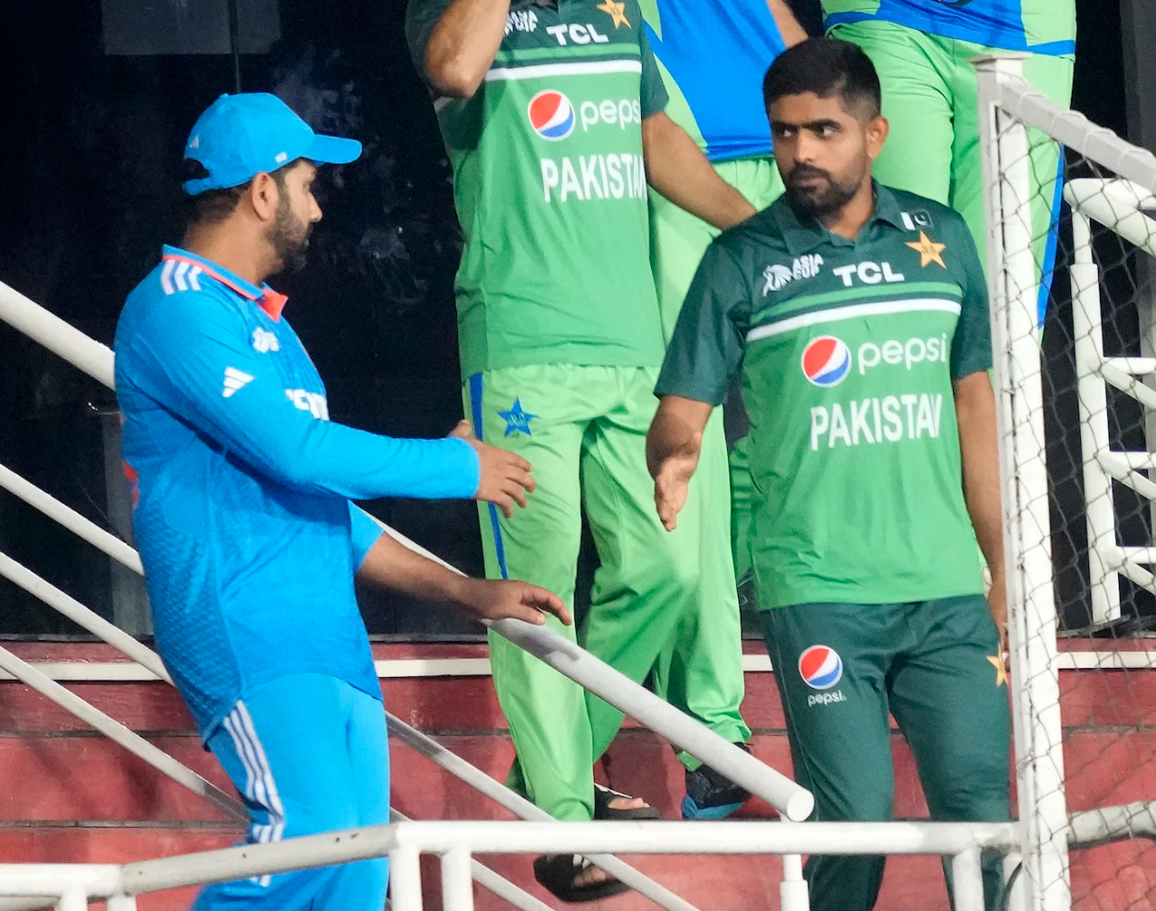 Babar Azam and Rohit Sharma shake hands after match in called off due to rains | Getty