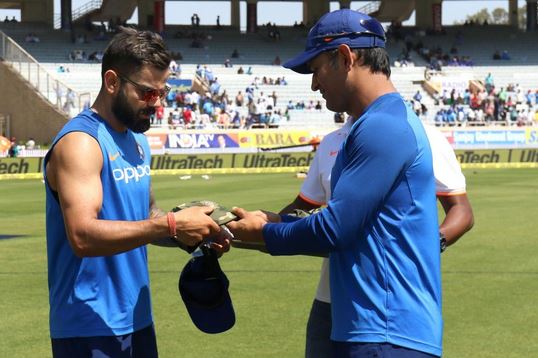 MS Dhoni presents Virat Kohli with a special cap to honor the Indian armed forces | BCCI Twitter