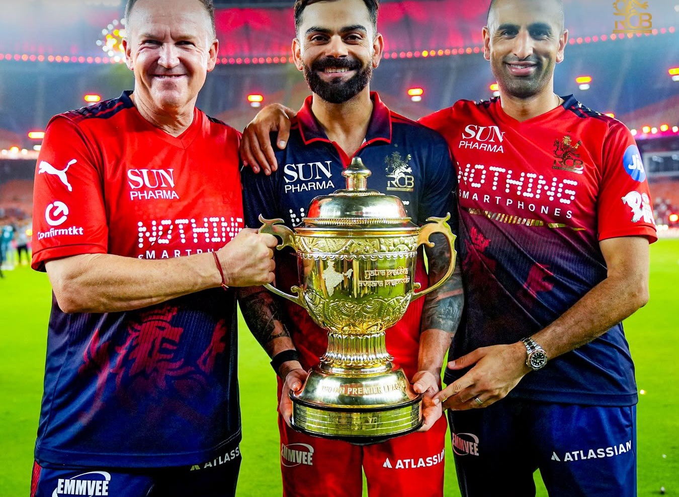 Andy Flower and Mo Bobat with Virat Kohli and the IPL 2026 trophy | RCB X