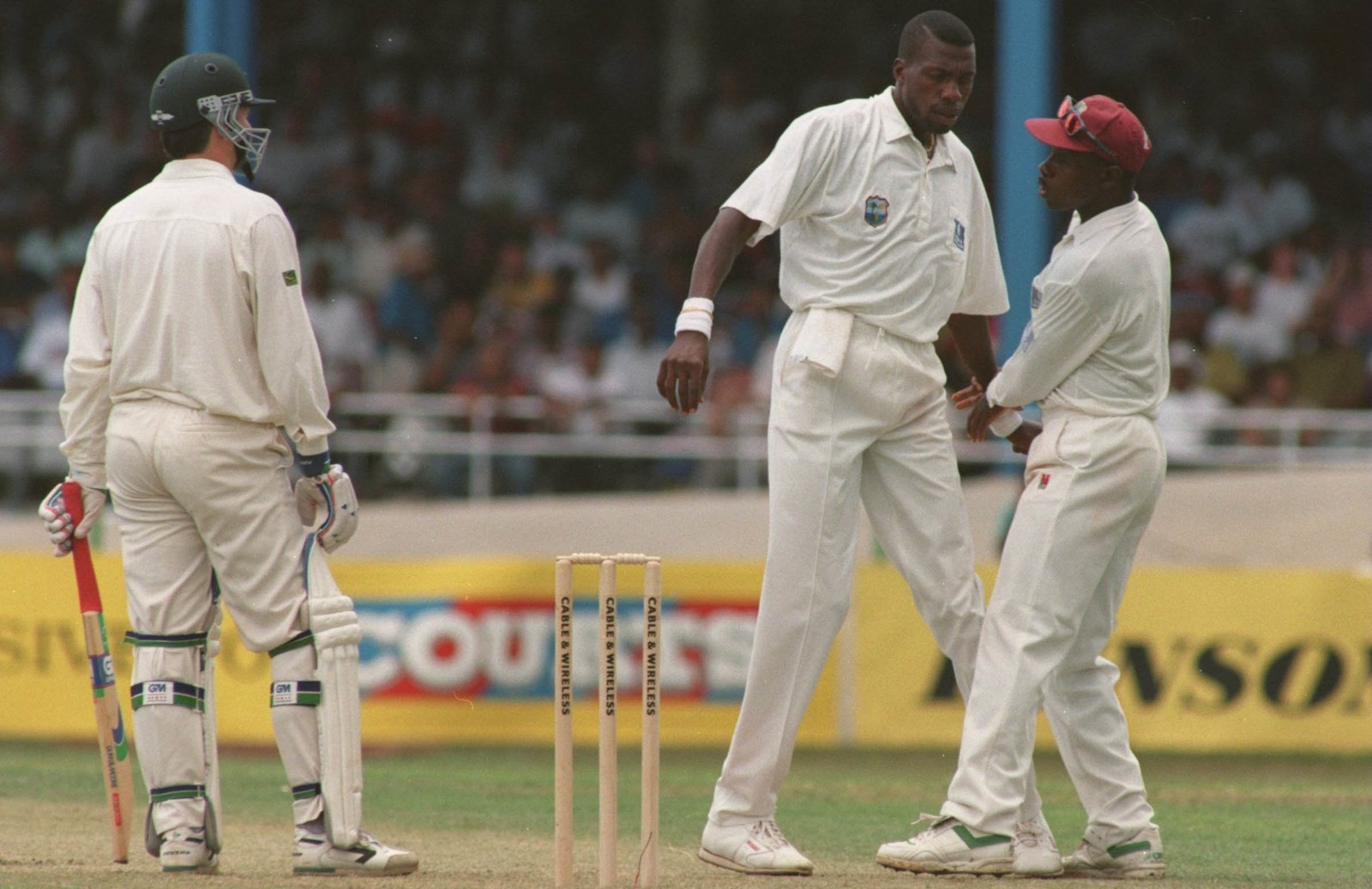 Ambrose being pulled away from Steve Waugh during a verbal battle