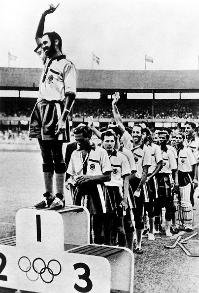 Balbir Singh on podium at 1956 Helsinki Olympics | Getty