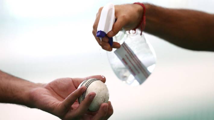 The ball will have to be sanitized everytime by the umpire if bowler uses saliva to shine it