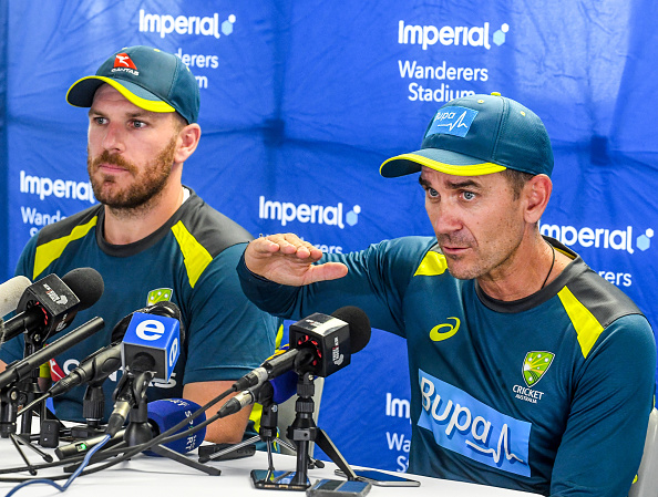 Justin Langer (R) with Aaron Finch (L) | Getty