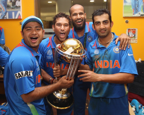 Piyush Chawla with Sachin Tendulkar, Yusuf Pathan and Gautam Gambhir holding 2011 WC trophy | Getty