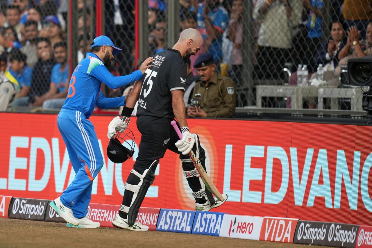Virat Kohli playfully pushes Daryl Mitchell out of boundary | Getty