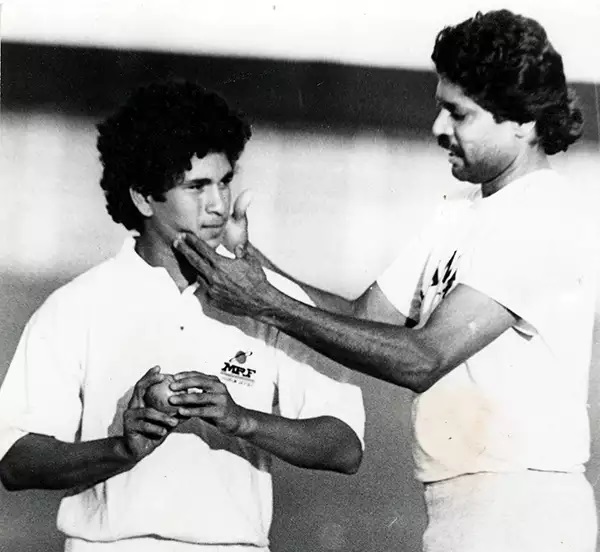 A young Sachin getting bowling lessons from Kapil Dev