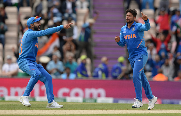 Virat Kohli (L) and Kuldeep Yadav (R) during the World Cup 2019 | Getty Images