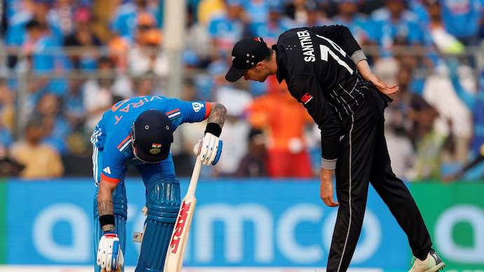 Mitchell Santner checking on Virat Kohli | Getty