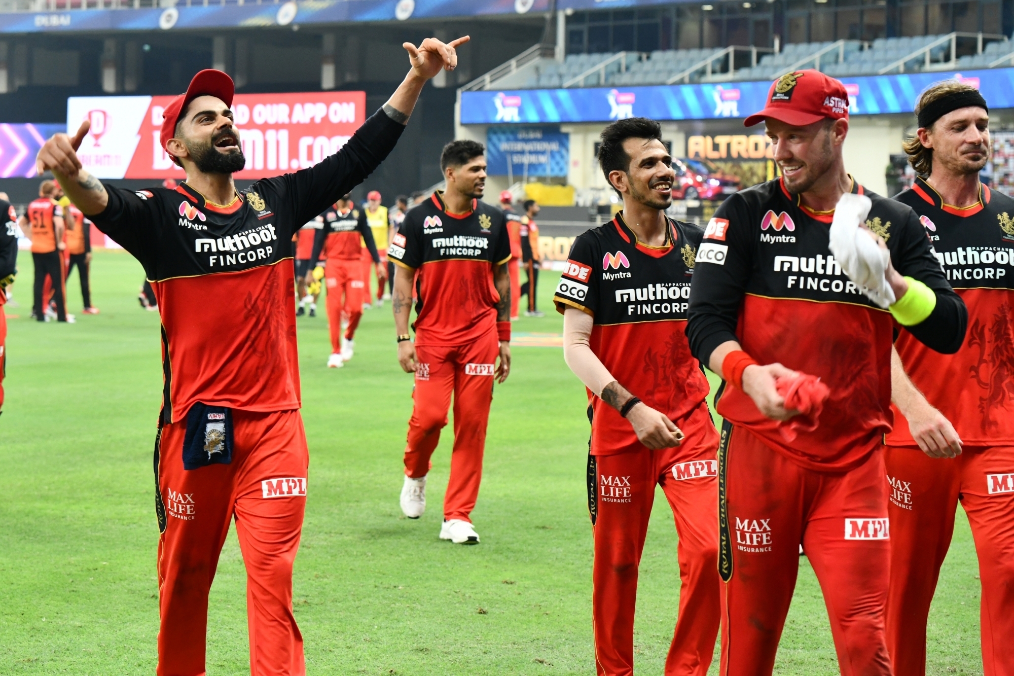 RCB players celebrate after their team's first win this season | IANS