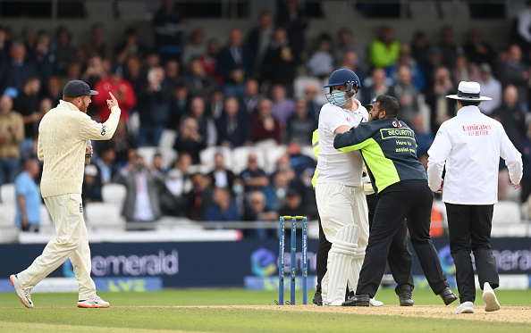 Security personnel at Headingley taking Jarvo out of the stadium | Getty