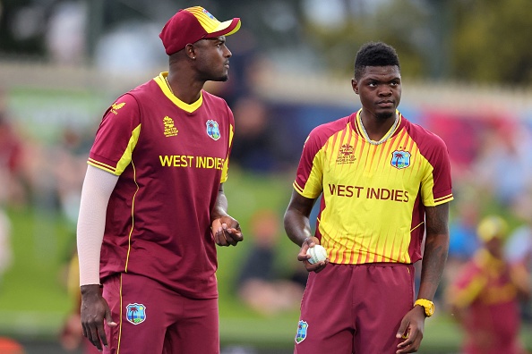 Alzarri Joseph and Jason Holder | Getty