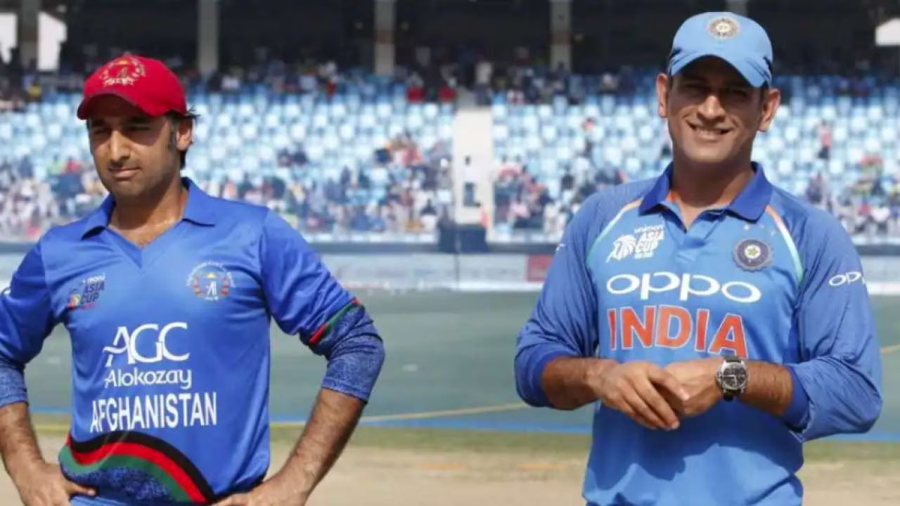 Asghar Afghan and MS Dhoni  | IANS