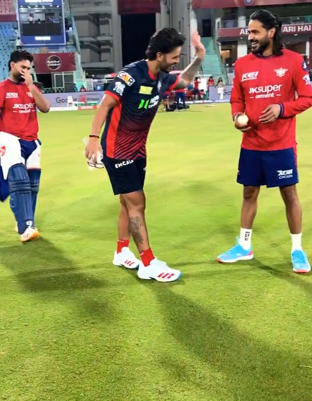 Pant watches as Nitish Rana and Digvesh Rathi converse | X