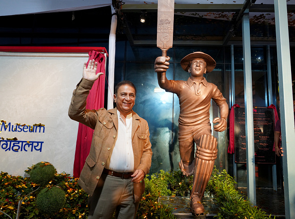 Sunil Gavaskar with his life-size statue at the Wankhede Stadium | Getty