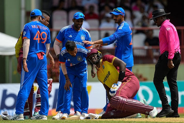 Akshar Patel checking on Jason Holder | Getty