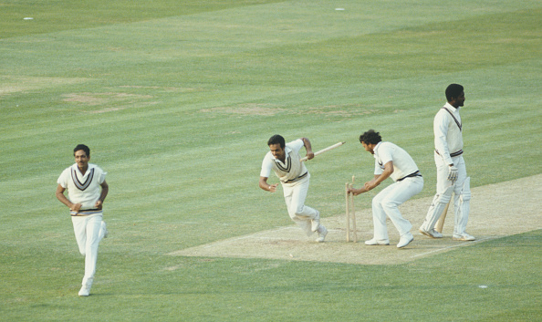 Victorious India players Yashpal Sharma and Roger Binny grab souvenir stumps as Mohinder Amarnath runs off the field | Getty