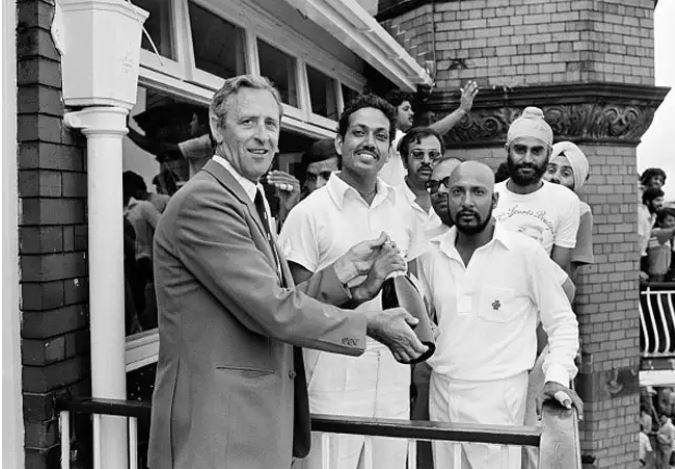 Mohinder Amarnath receives a champagne bottle as his Man of the Match prize in SF vs England