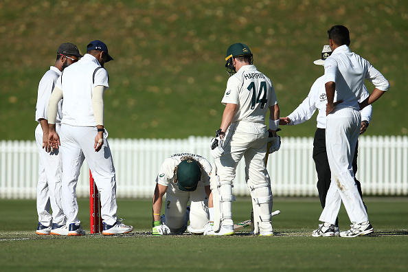Will Pucovski fell to his knees after getting hit by Kartik Tyagi’s well-directed bouncer | Getty