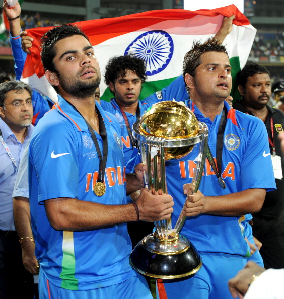 Virat Kohli and Suresh Raina with the World Cup trophy in 2011 | Getty