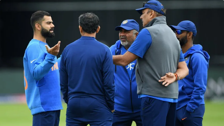 Shastri with Virat Kohli and his coaching staff | AFP
