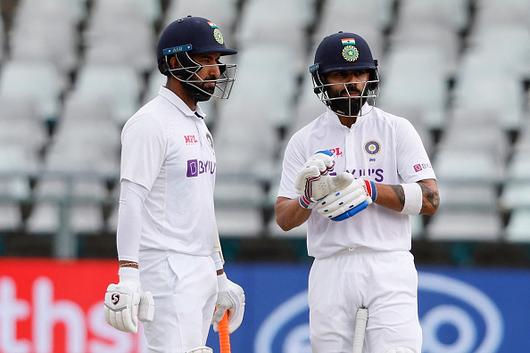 Cheteshwar and Virat Kohli | Getty