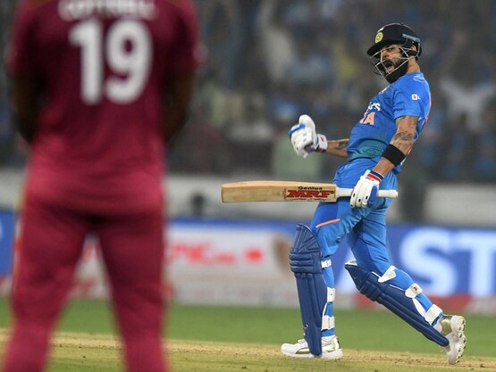 Virat Kohli celebrates after guiding over the line in the first T20I against West Indies | AFP