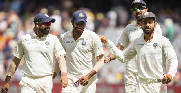 Virat Kohli points to the man of the moment, Jasprit Bumrah, who picked 6/33 | Getty