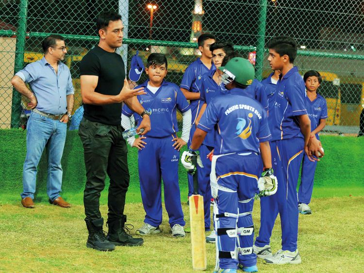 MS Dhoni with kids during a session in his academy | Twitter