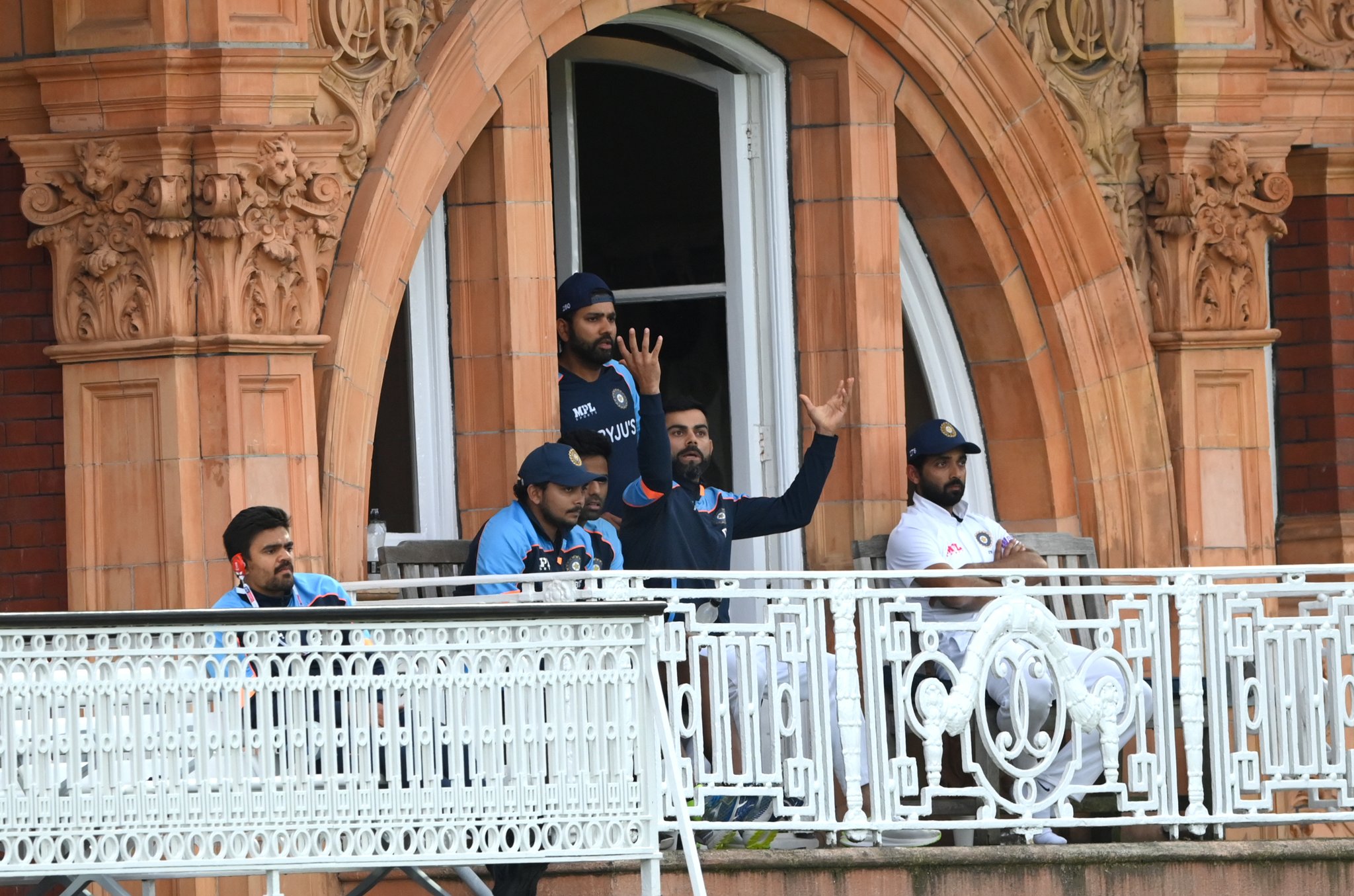 Virat Kohli gestures from the balcony | Getty Images