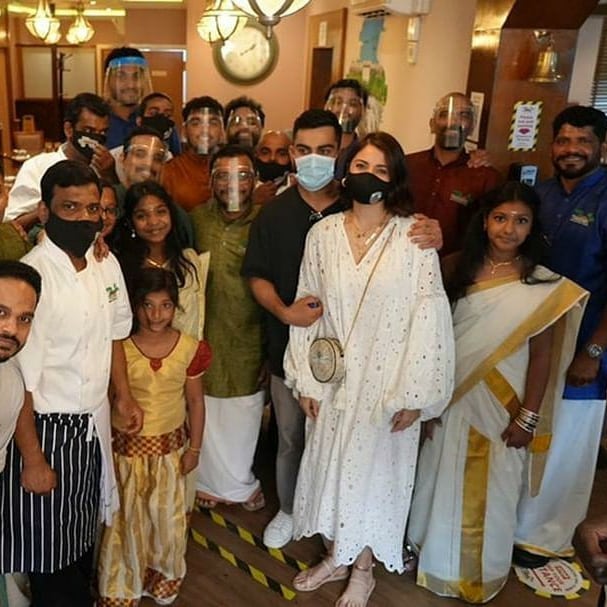 Virat Kohli and Anushka Sharma posed with the restaurant staff | Instagram
