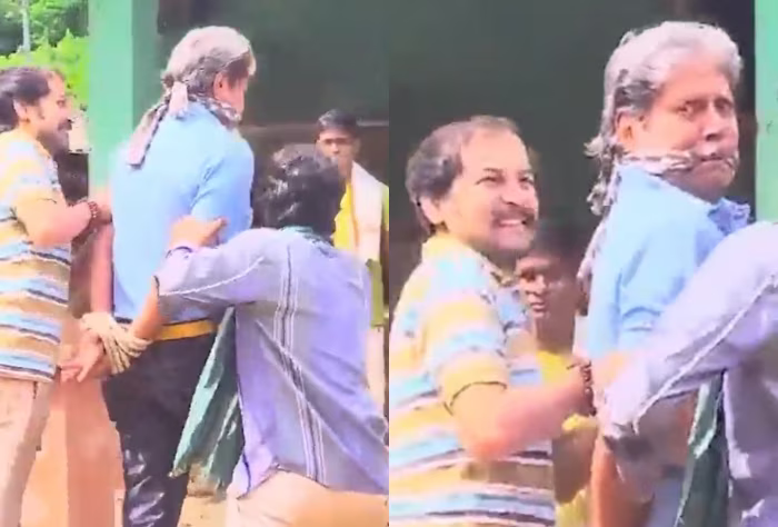 Kapil Dev was seen in a viral video being forcibly escorted by some men into a hut | X
