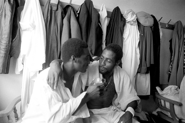 Michael Holding (L) and Sir Viv Richards (R) in their cricketing days | Getty
