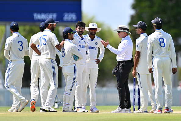 India A players talking to umpire about ball change on the final day | Getty