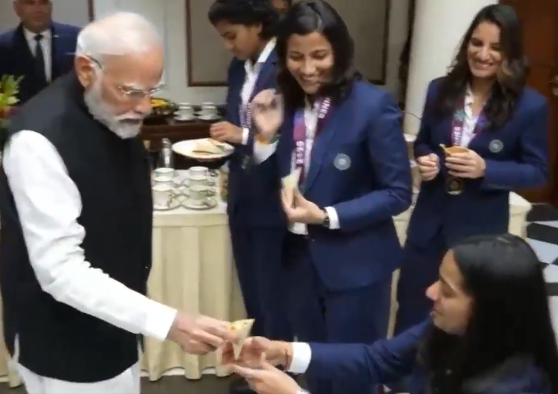 PM Modi offering a sweet to Pratika Rawal | X